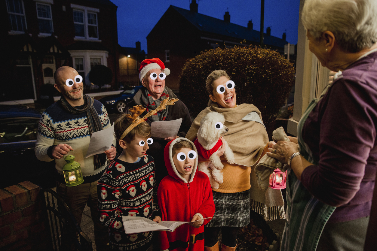 A group of carol singers at someone's door