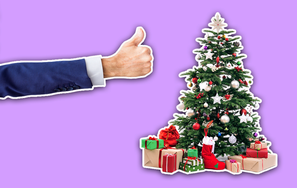 Person giving a well decorated tree a thumbs up
