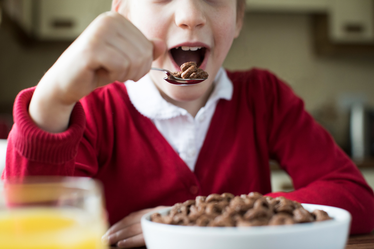A child eating a bowl of cereal