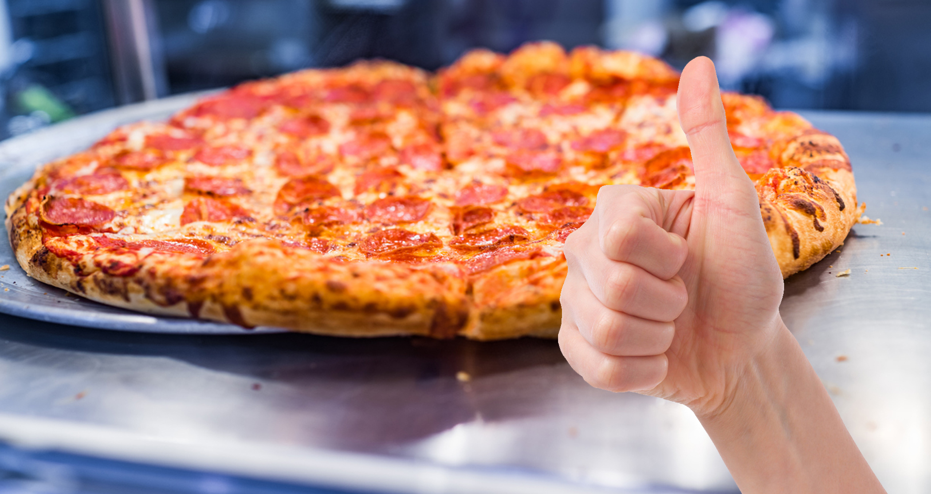 A person giving a hot pizza a thumbs up
