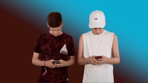 Max and Harvey using their phones