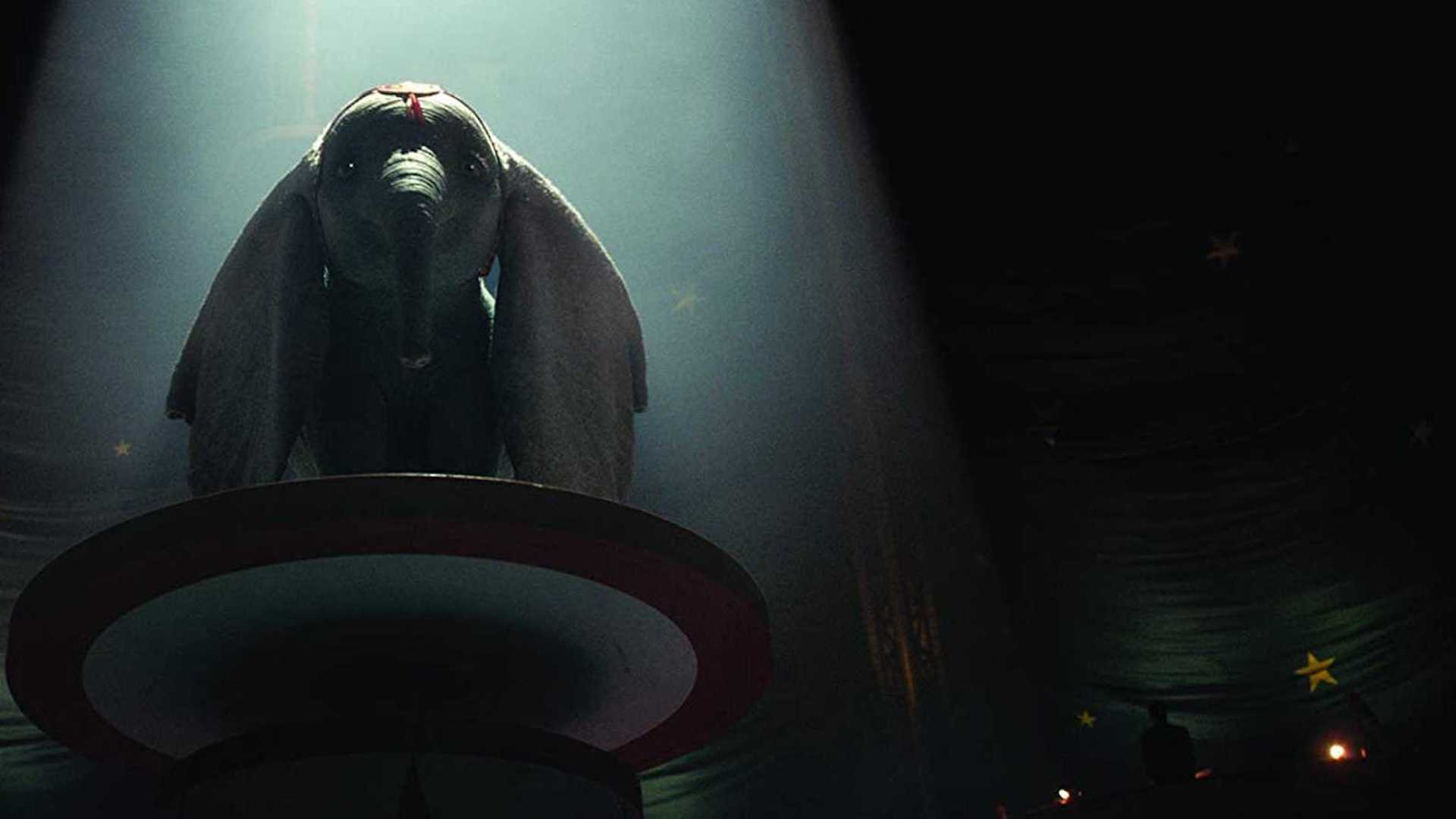 Dumbo standing on a podium in the new version of the film