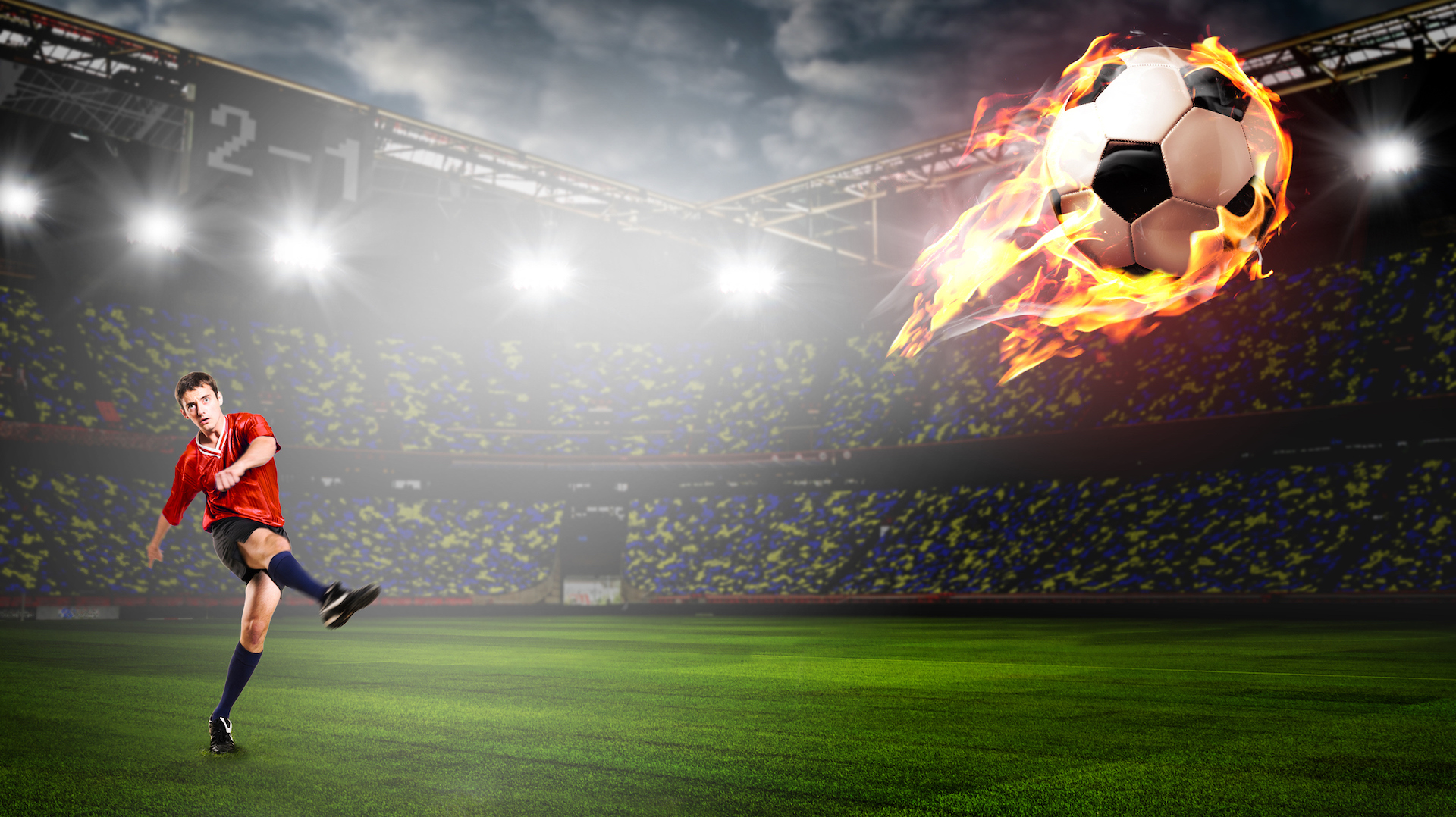 A footballer kicks the ball so hard it bursts into flames