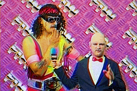 A wrestler lets off next to an interviewer 