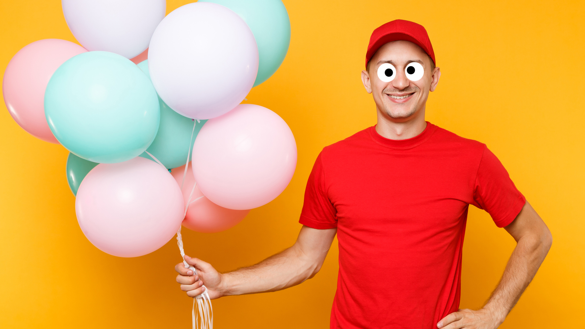 A man holding a bunch of balloons
