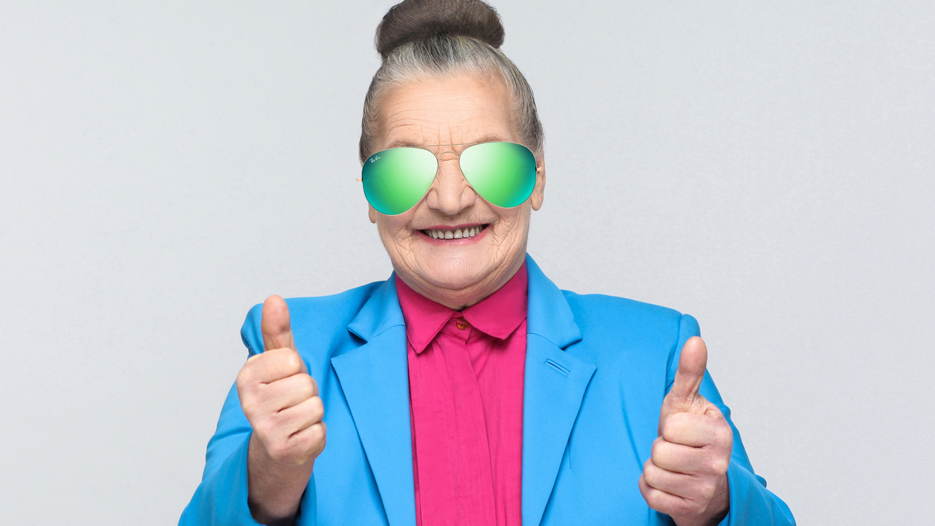 Woman with big oversized sunglasses giving a thumbs up