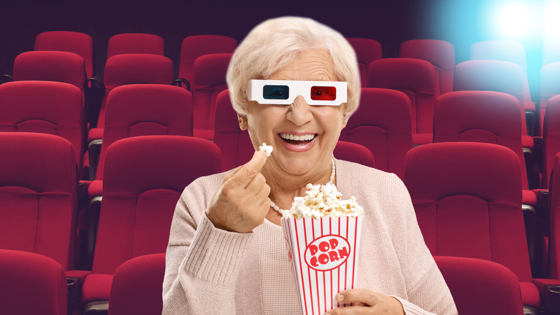 A gran eating popcorn at the cinema