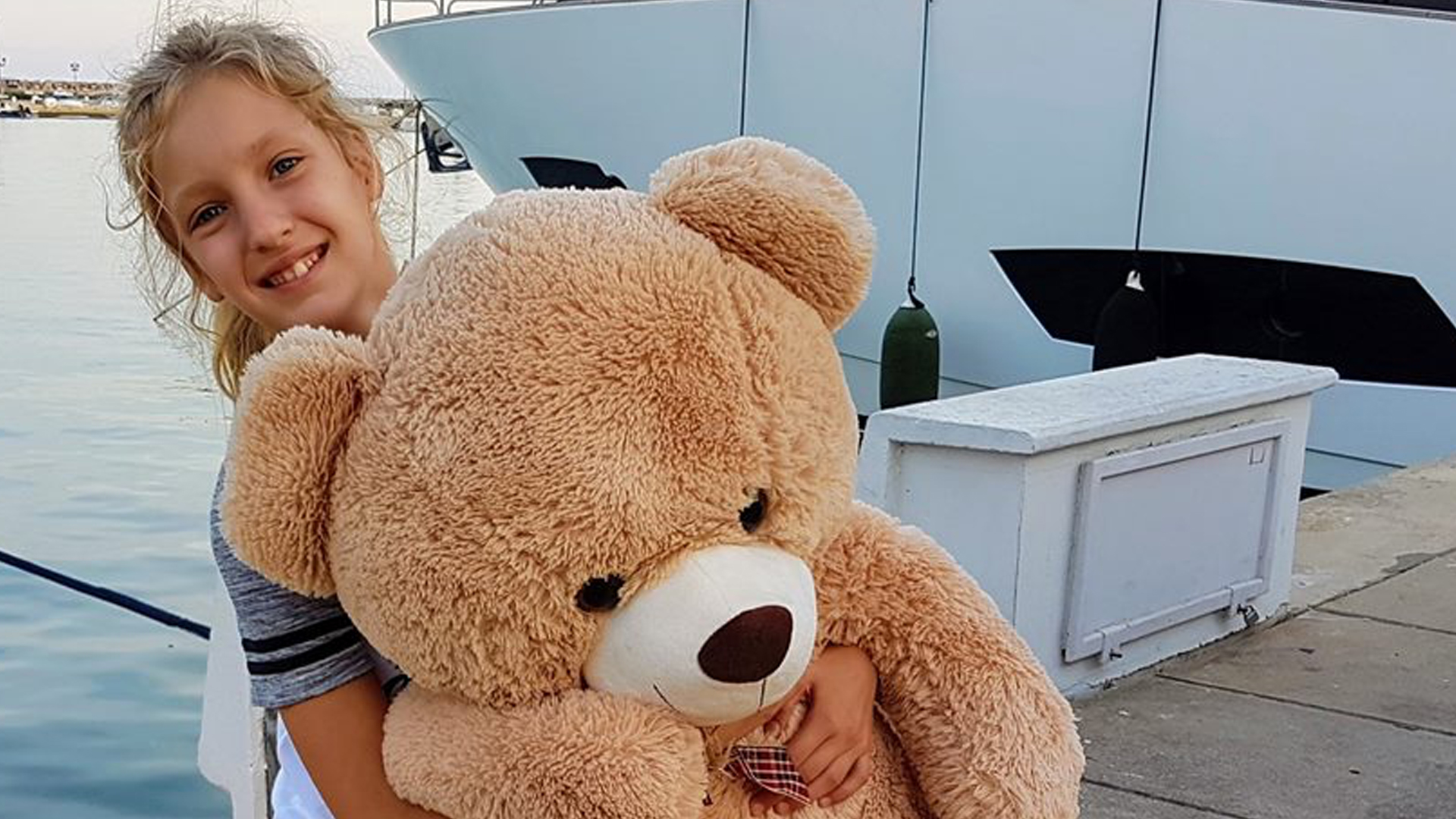 Sis holding a massive bear