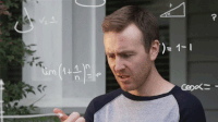 A man working out a maths problem | Maths quiz