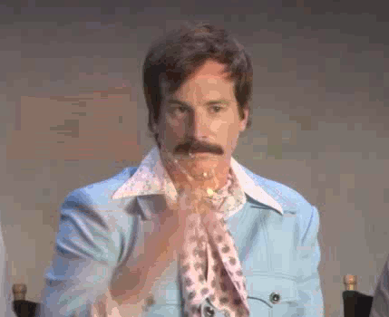 A man throwing a handful of glitter