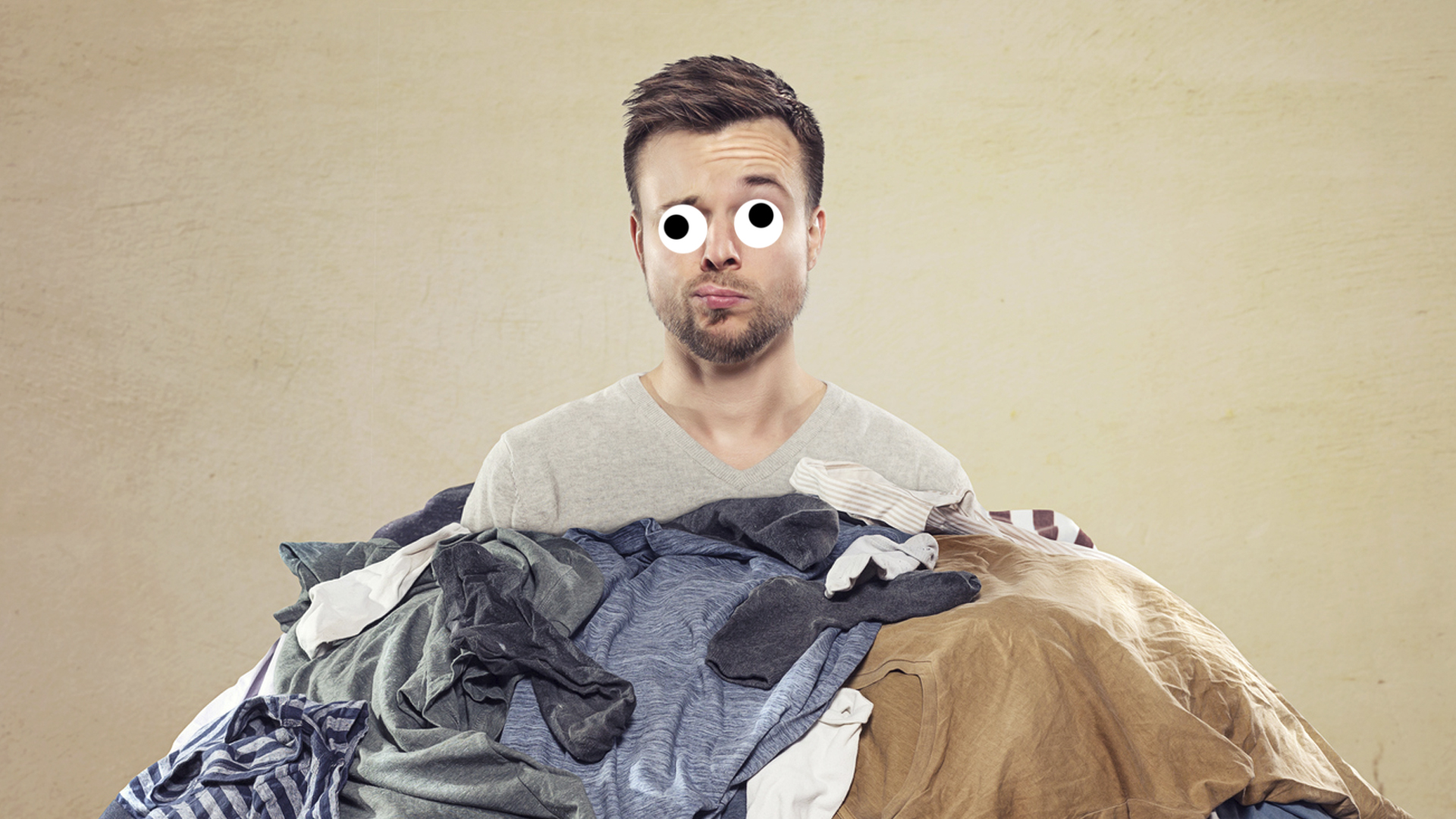 A man surrounded by laundry