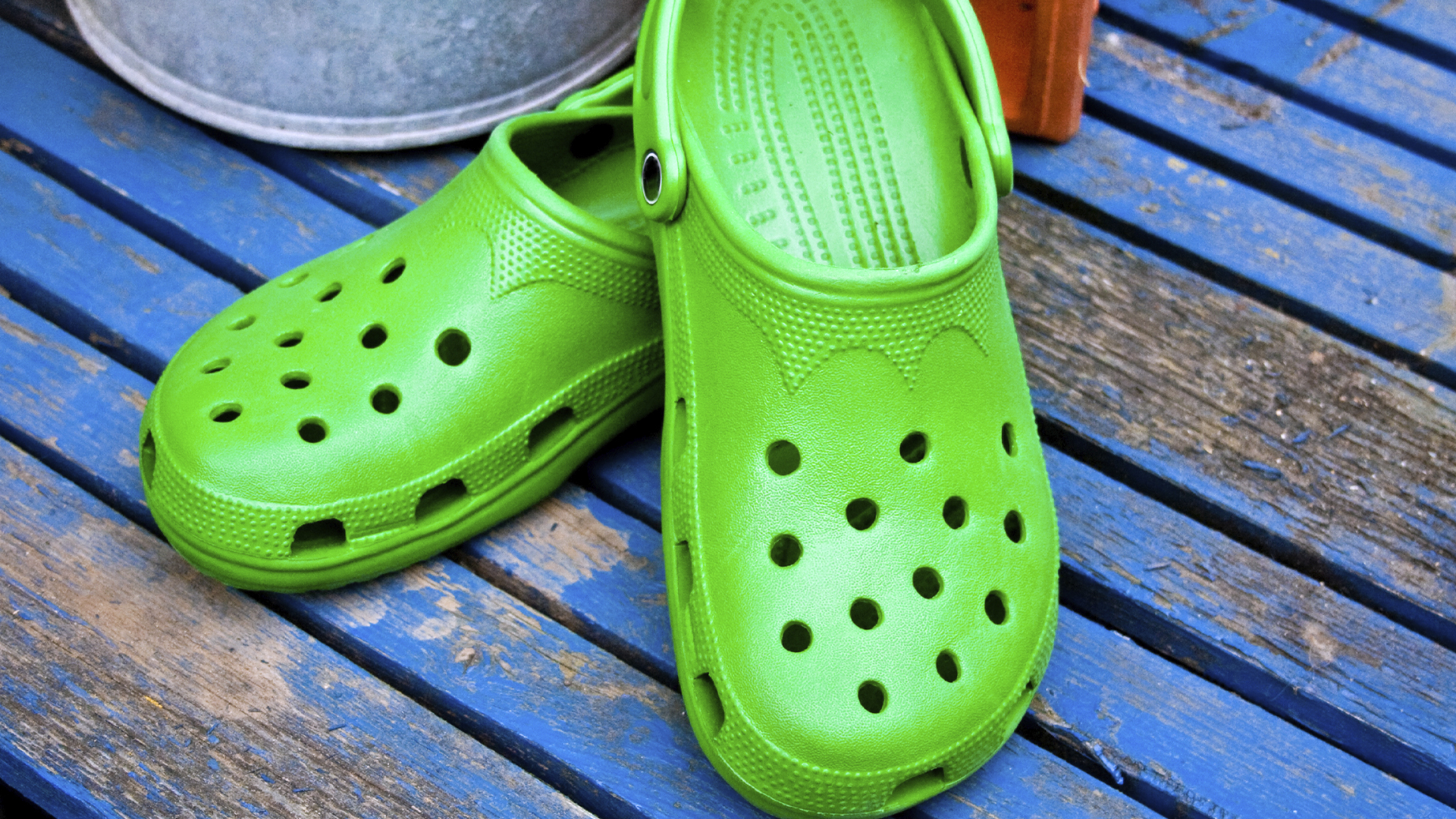 A pair of bright green crocs