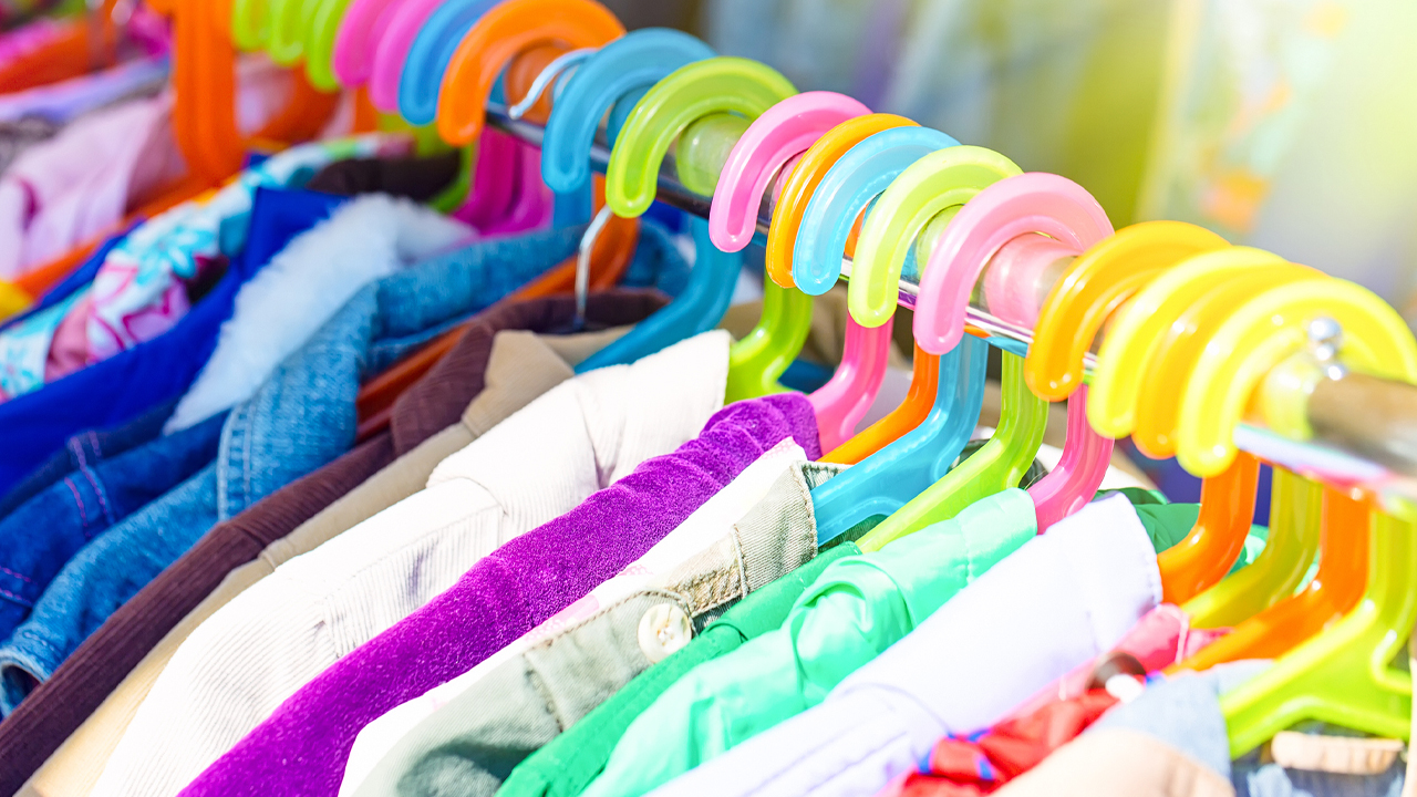 A clothes rack full of colourful stuff