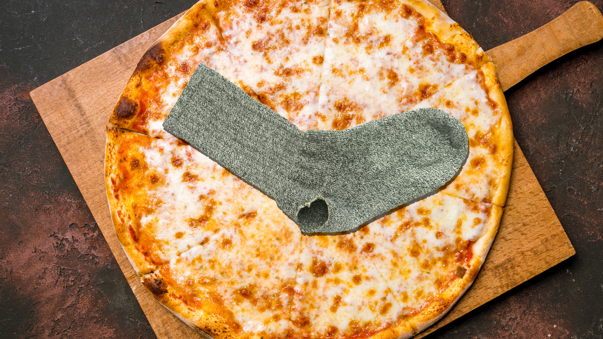 A pizza with a sock as a topping 