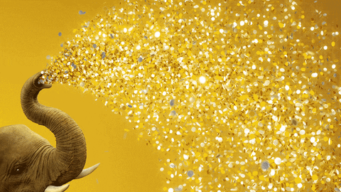 A elephant showering everything in glitter
