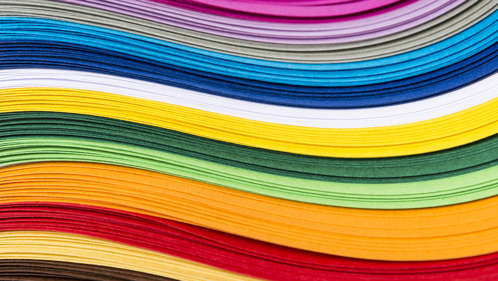 A pile of brightly coloured paper