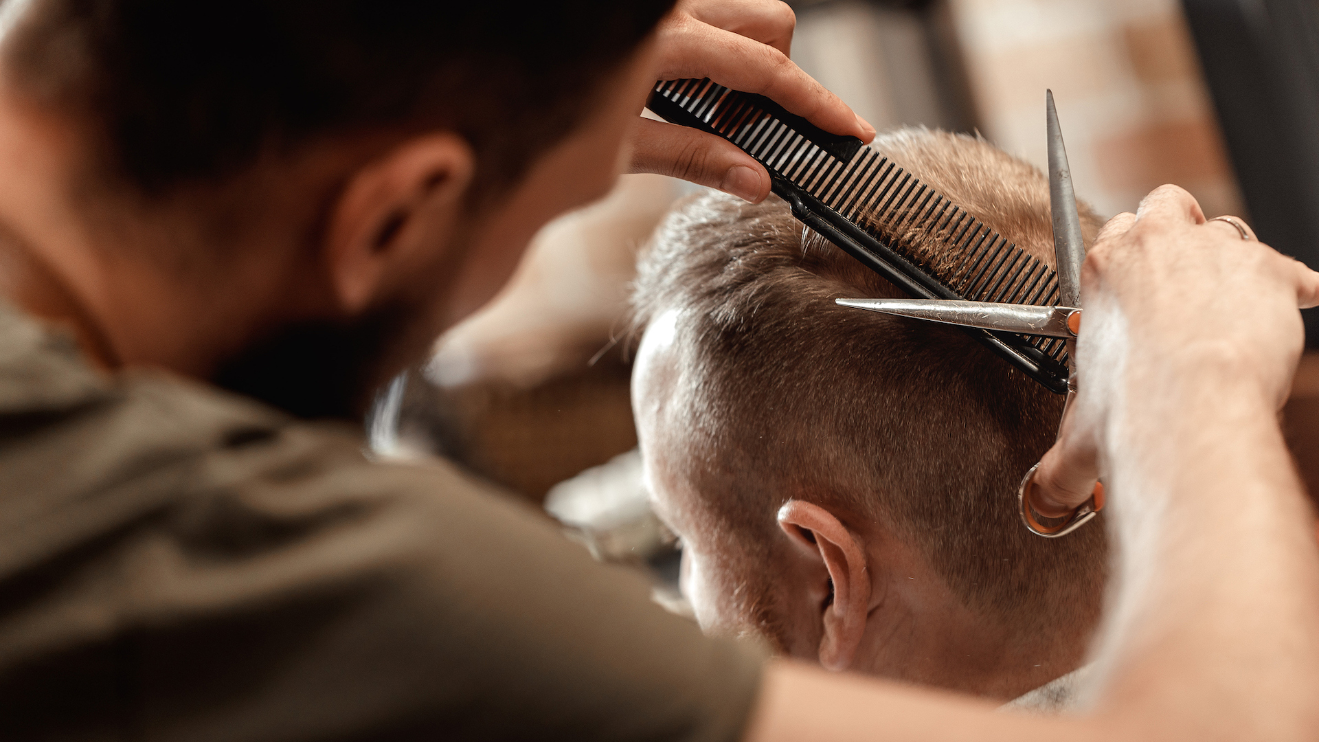A barber giving a customer a haircut