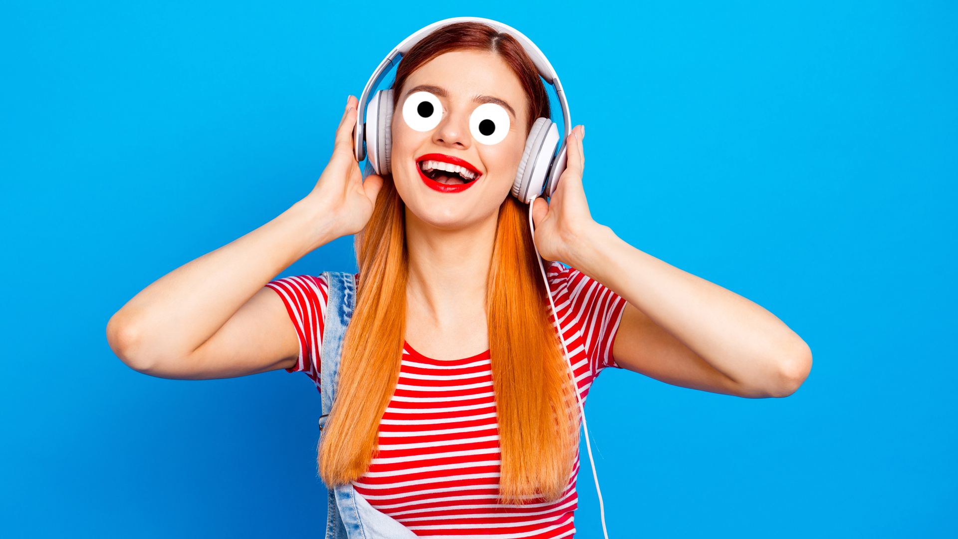 A woman wearing headphones and singing