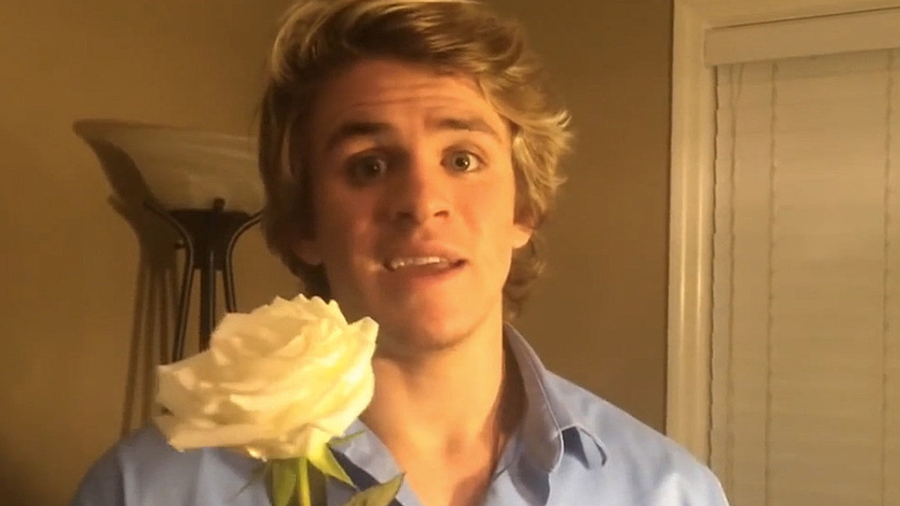 Cole LaBrant poses with a rose