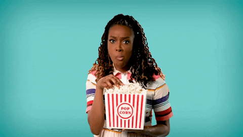 A woman eating popcorn 