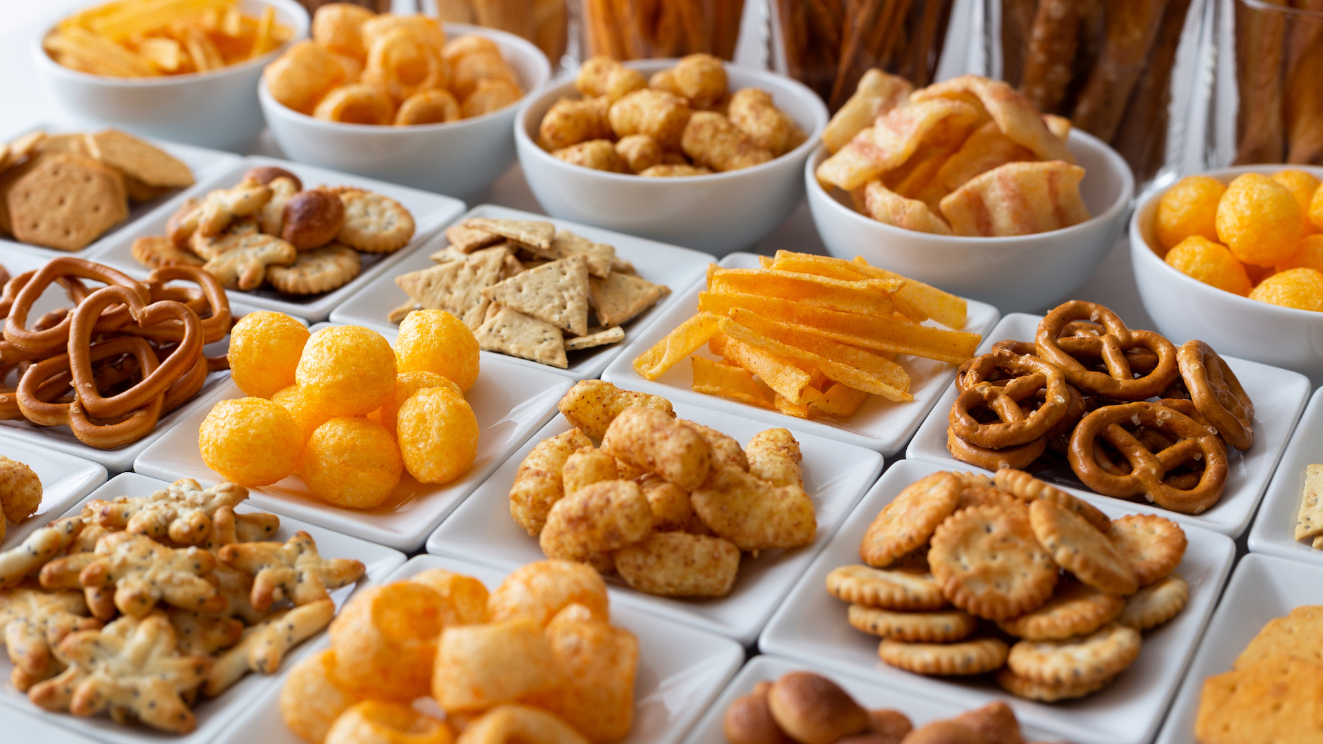 A tray full of crisps and snacks