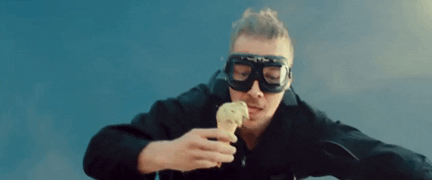 A man skydiving while eating ice cream