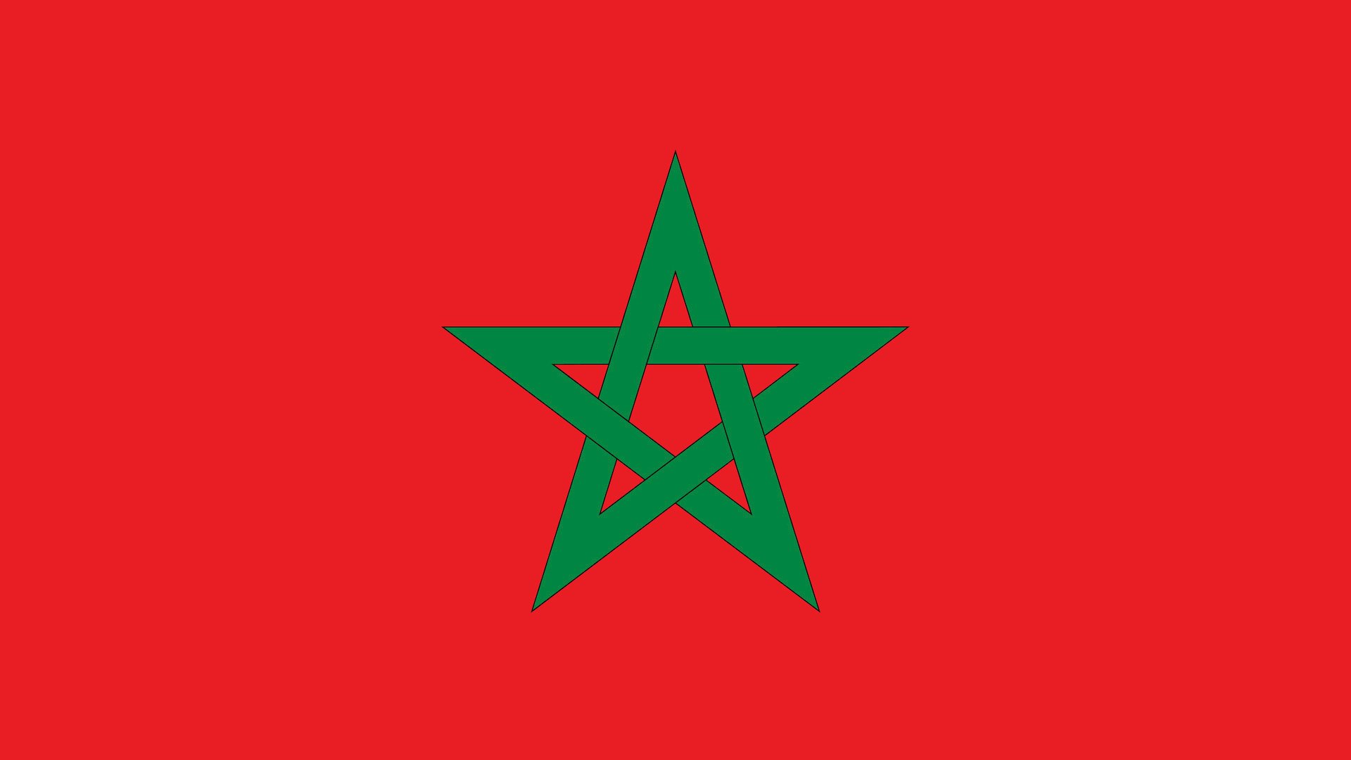 A red flag with a green pentagram