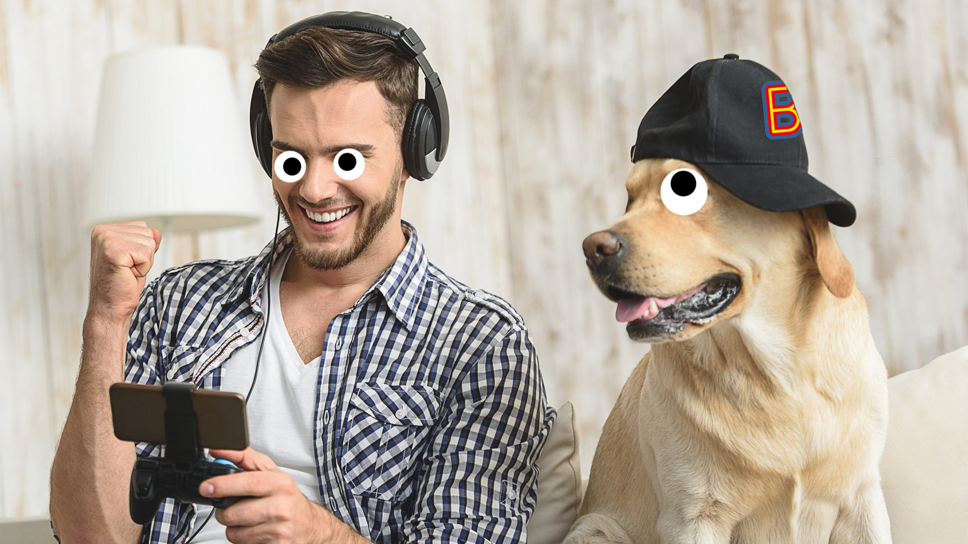 A man and his pet dog watching something on a phone
