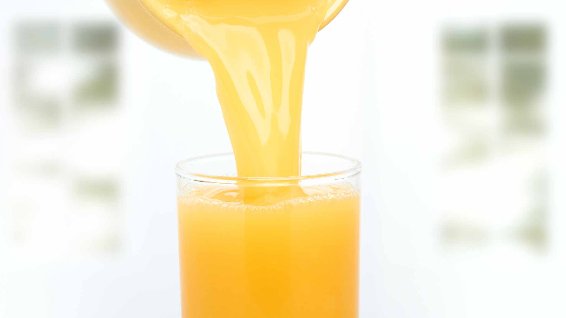 Orange juice being poured