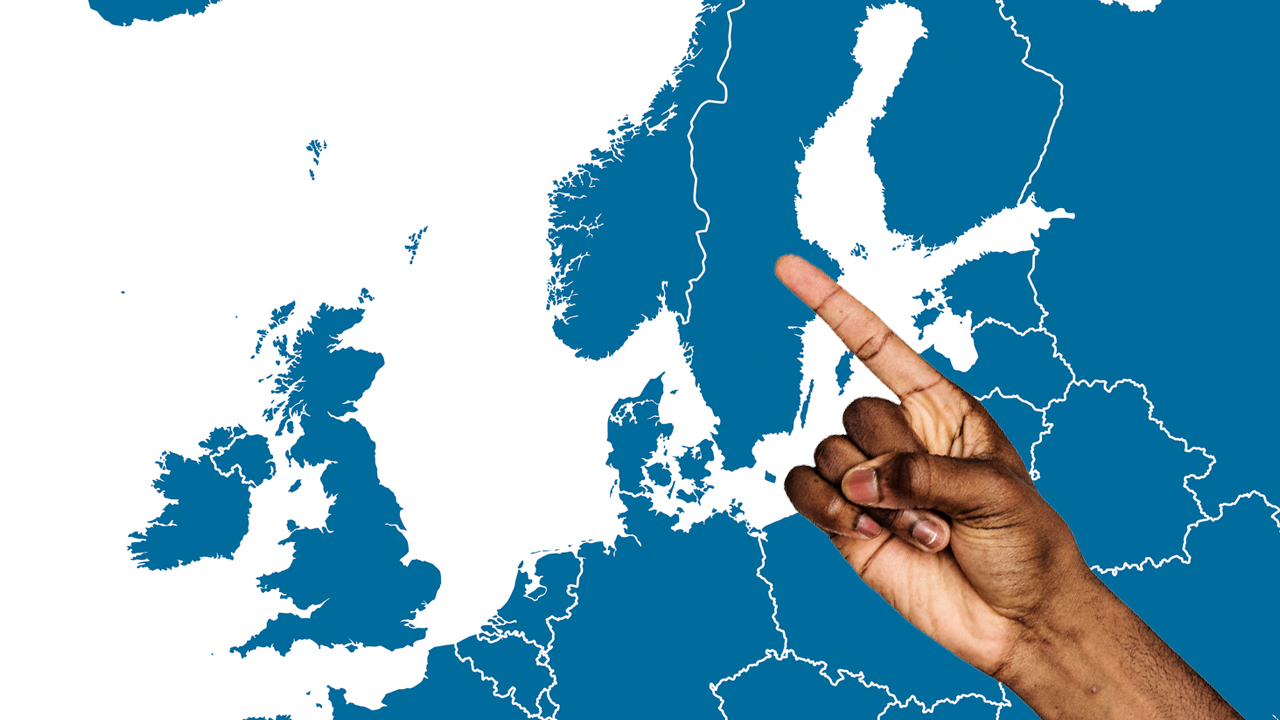 A finger pointing to a Scandinavian country
