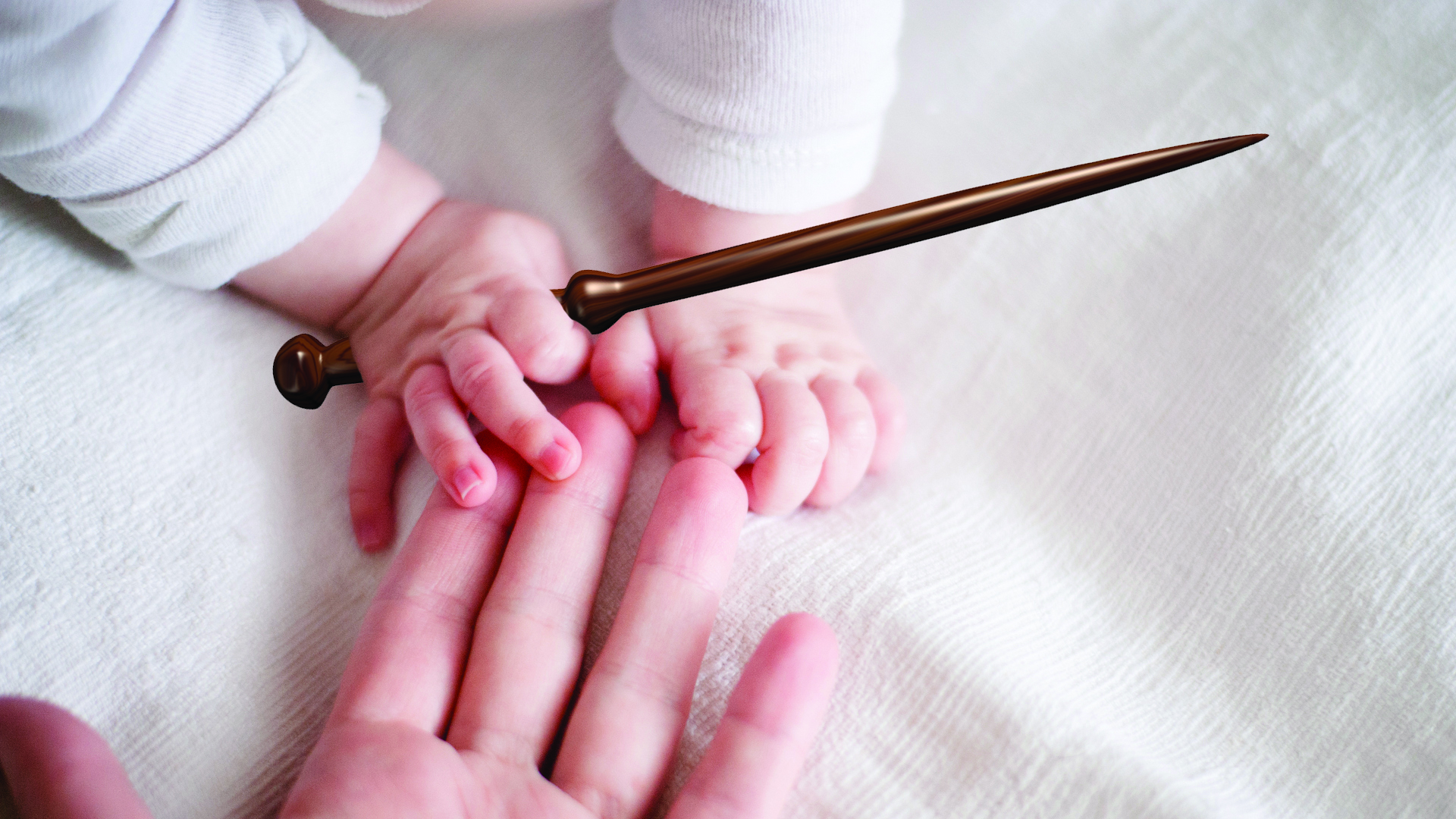 A tiny wizard baby holds a wand