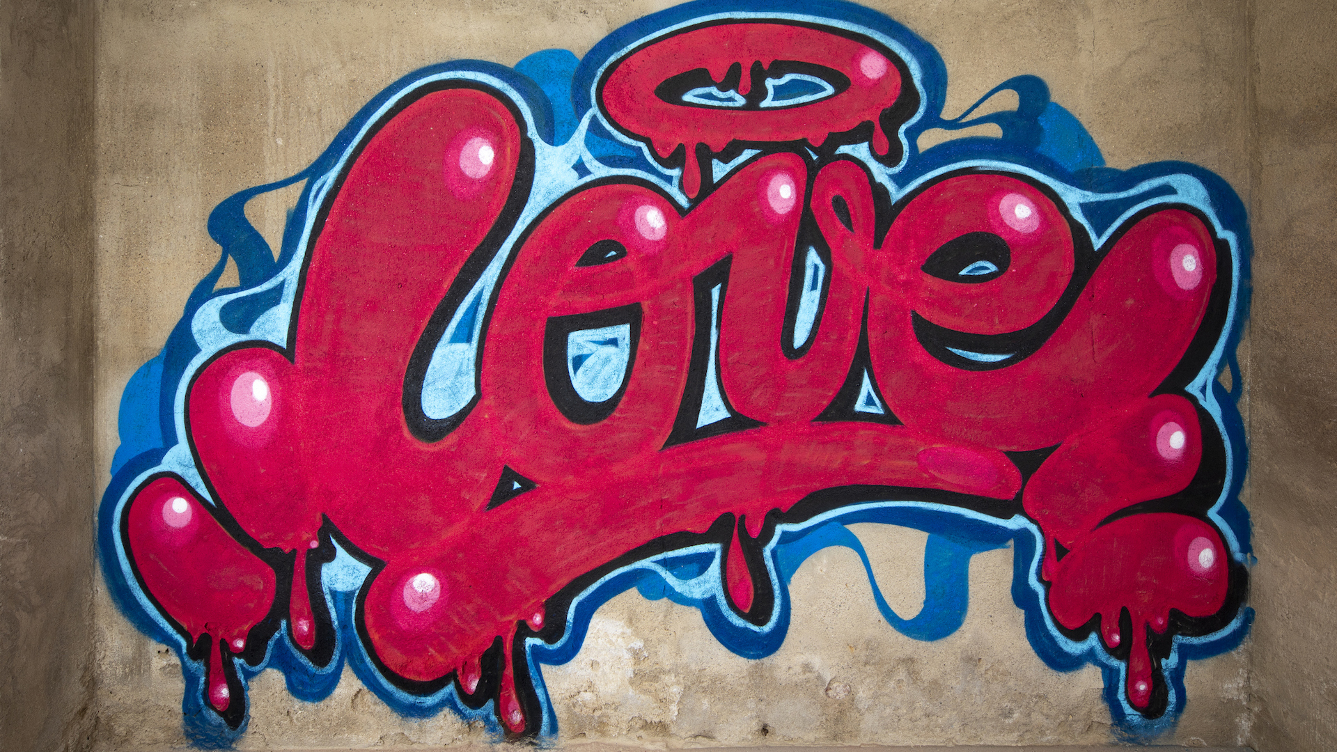 Love: colourful graffiti on a concrete wall