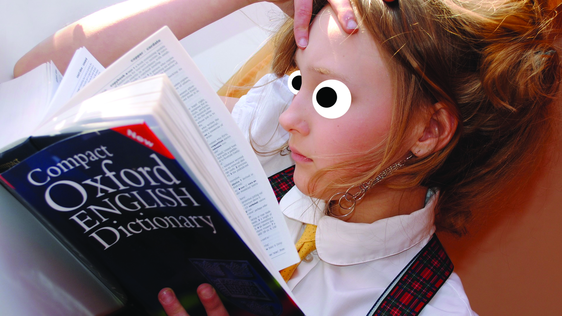 A girl reading the English dictionary