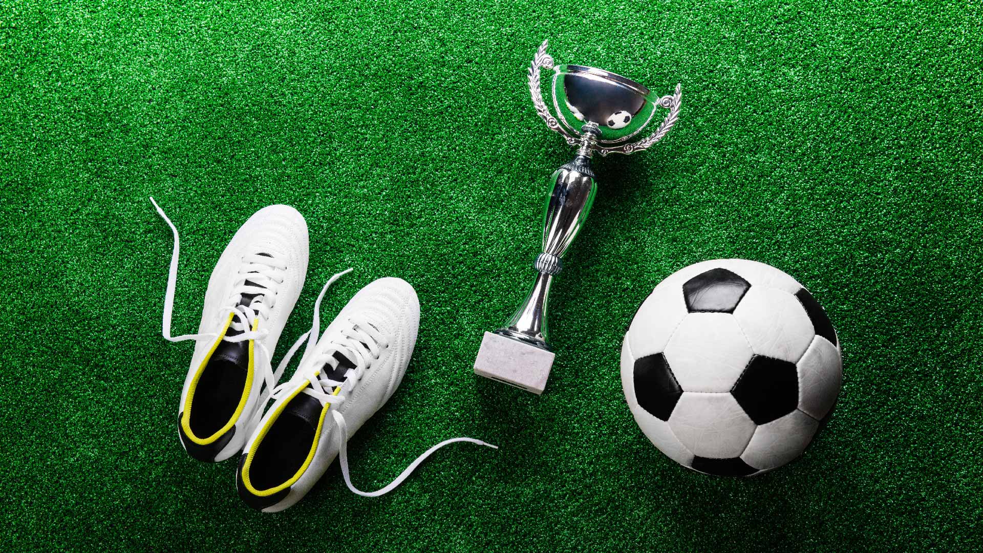Football boots, a trophy and a football