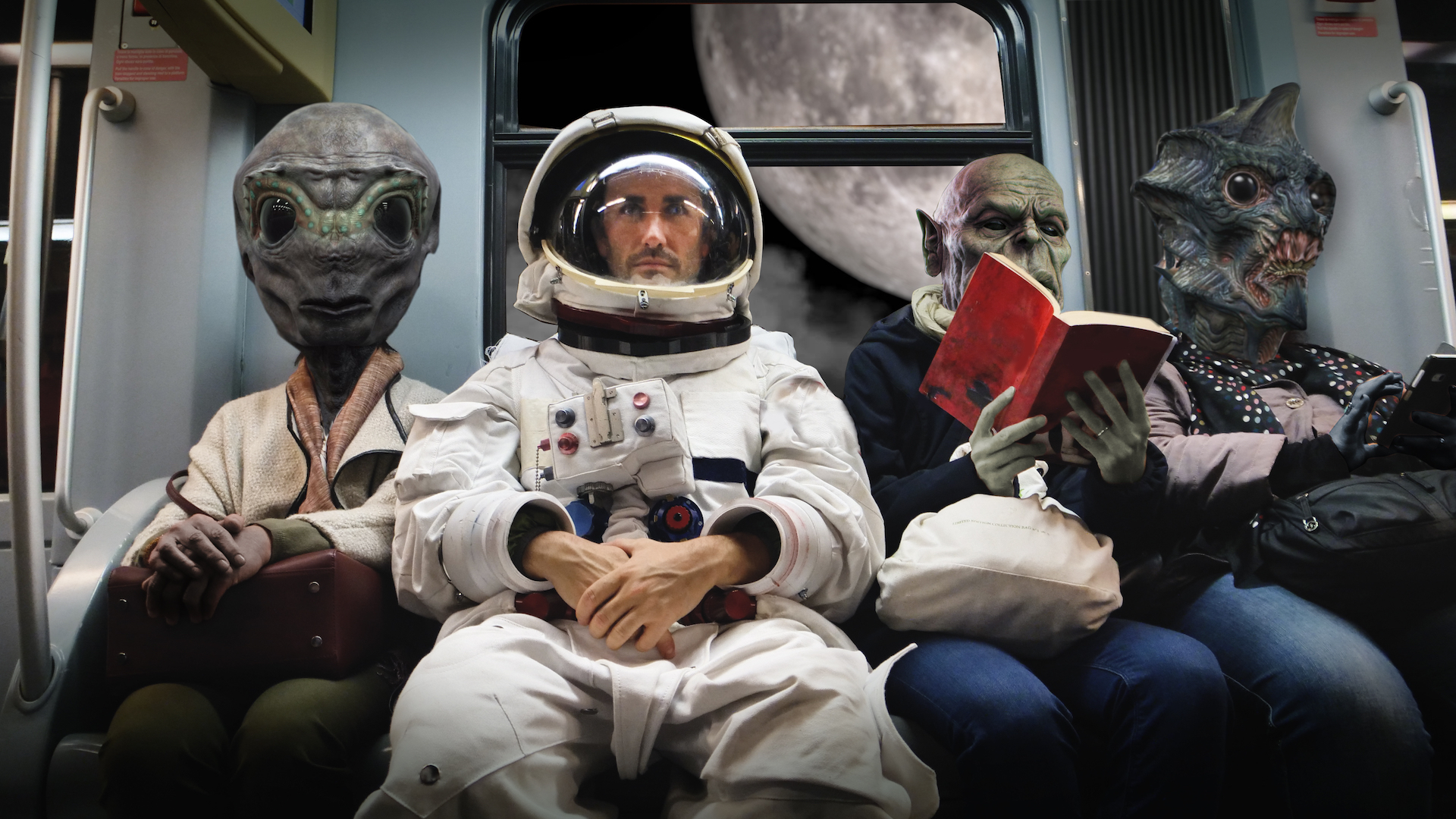 An astronaut and three aliens sitting on a train going to the moon