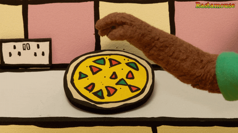 Rastamouse sprinkling pizza with spice