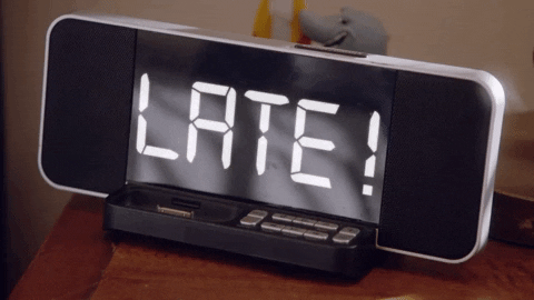 An alarm clock says 'late'