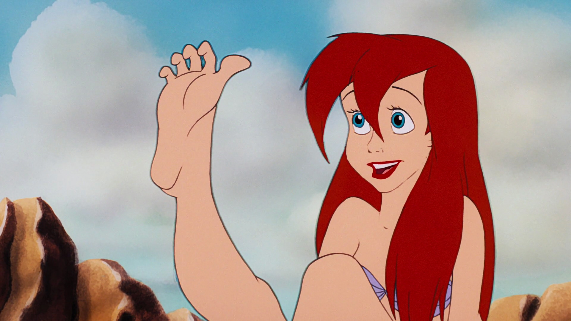 Ariel looks at her new feet
