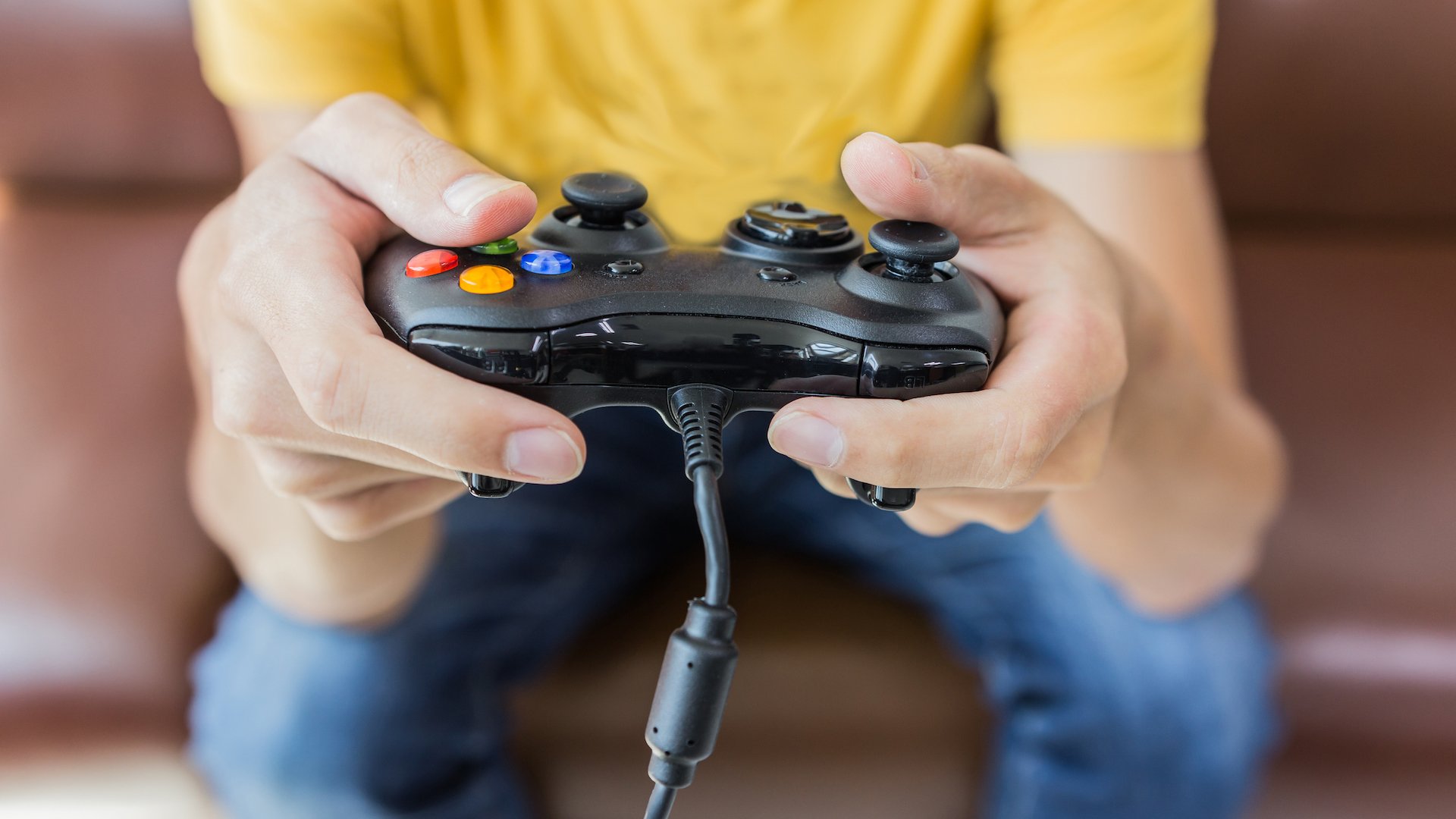 A man holding a video game controller