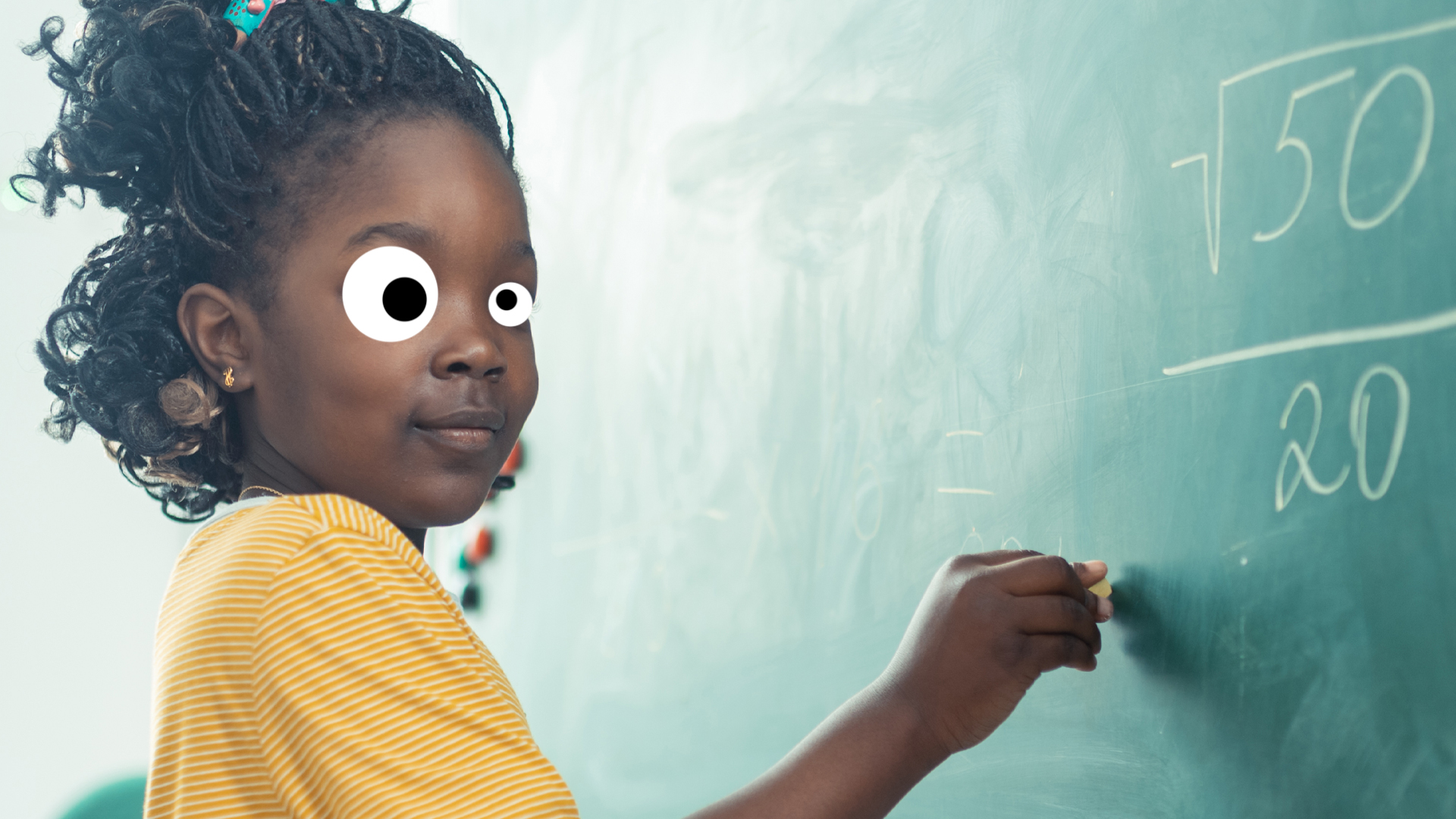 A girl solving a maths problem on a chalkboard