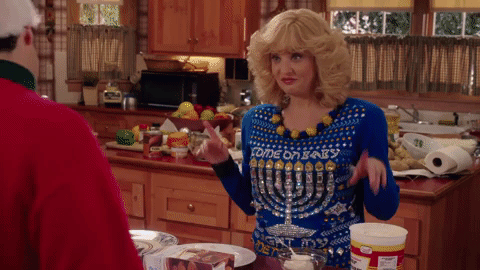 Beverly Goldberg wears a Hanukkah-themed jumper 