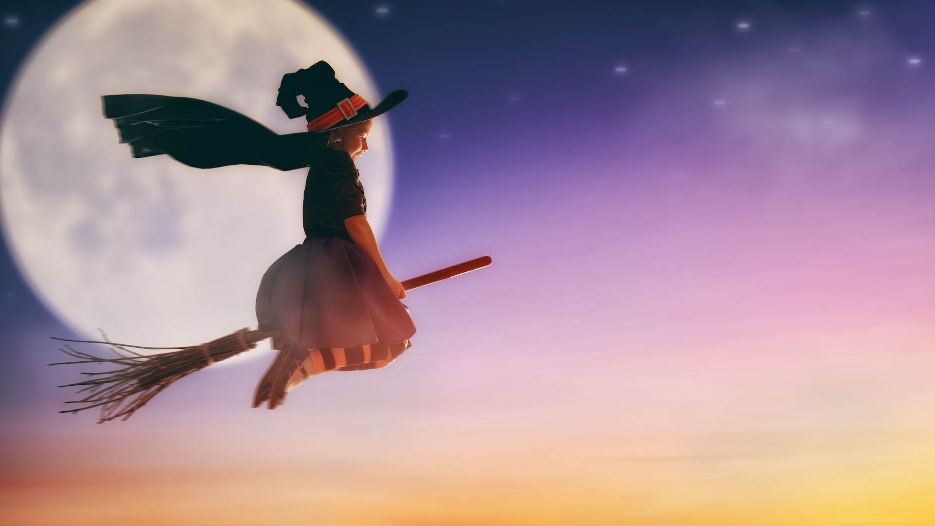 A witch flying on a broomstick