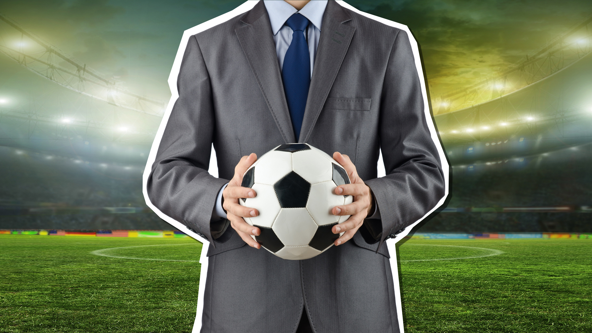 A football manager in a suit and holding a ball