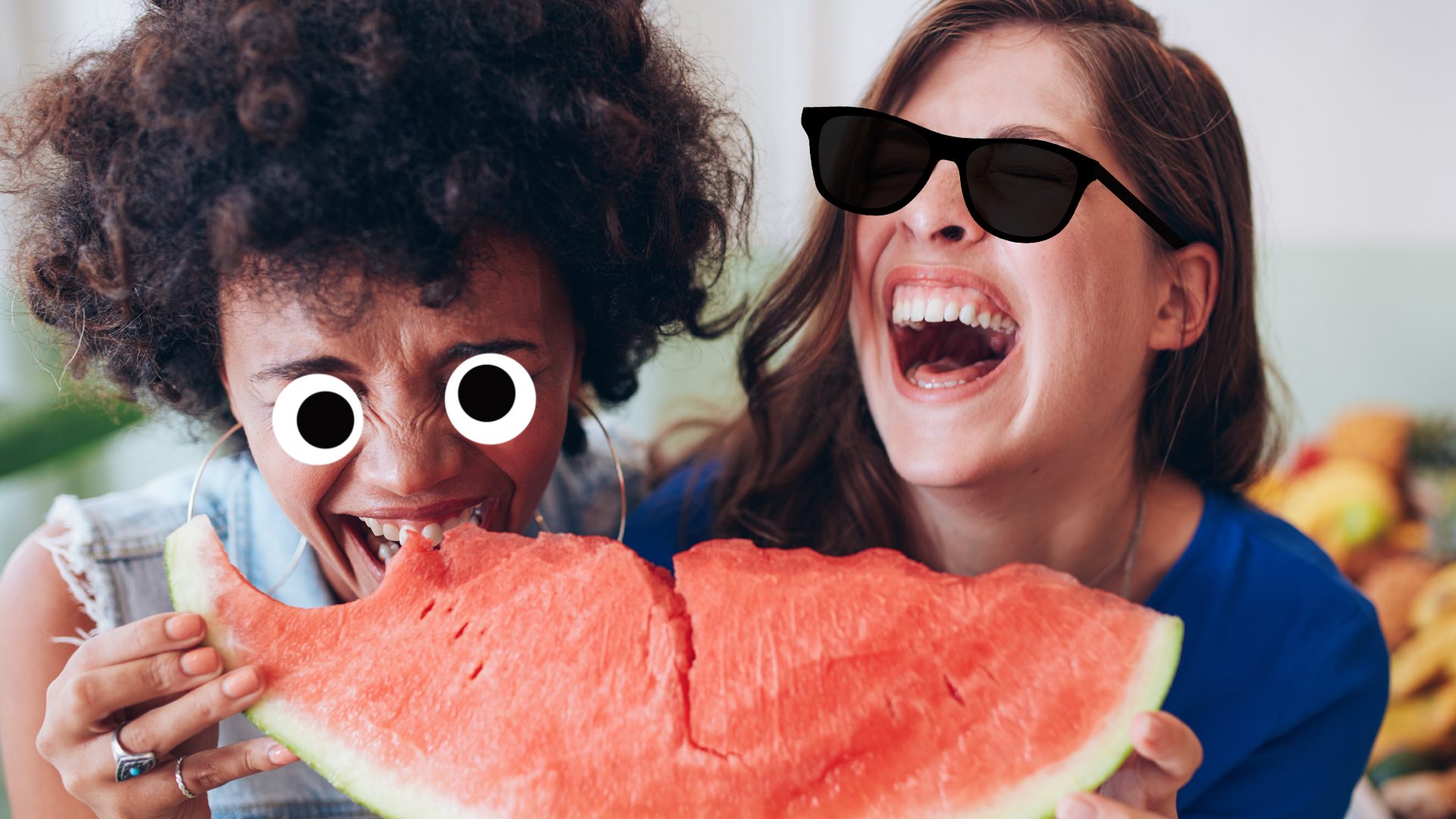 Two women laughing at fruit