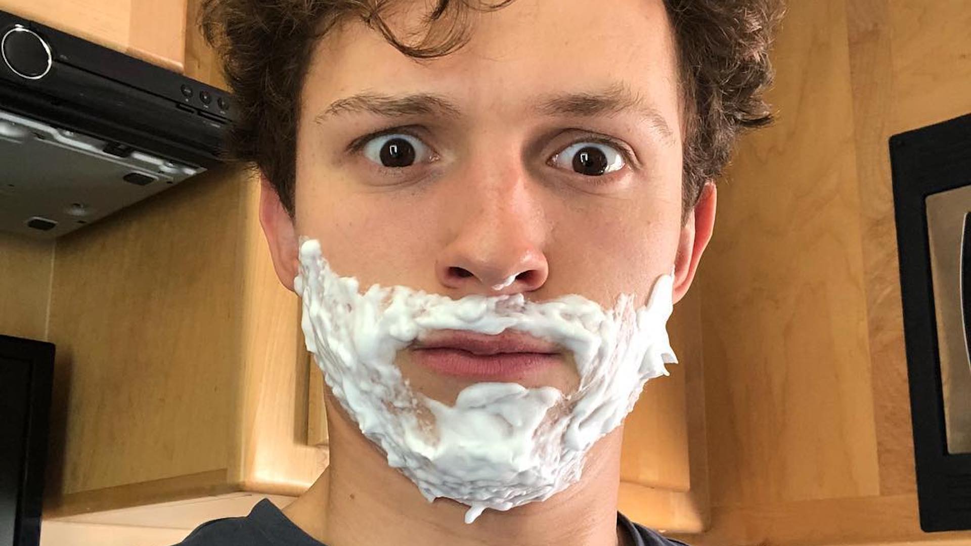 Tom Holland having a shave