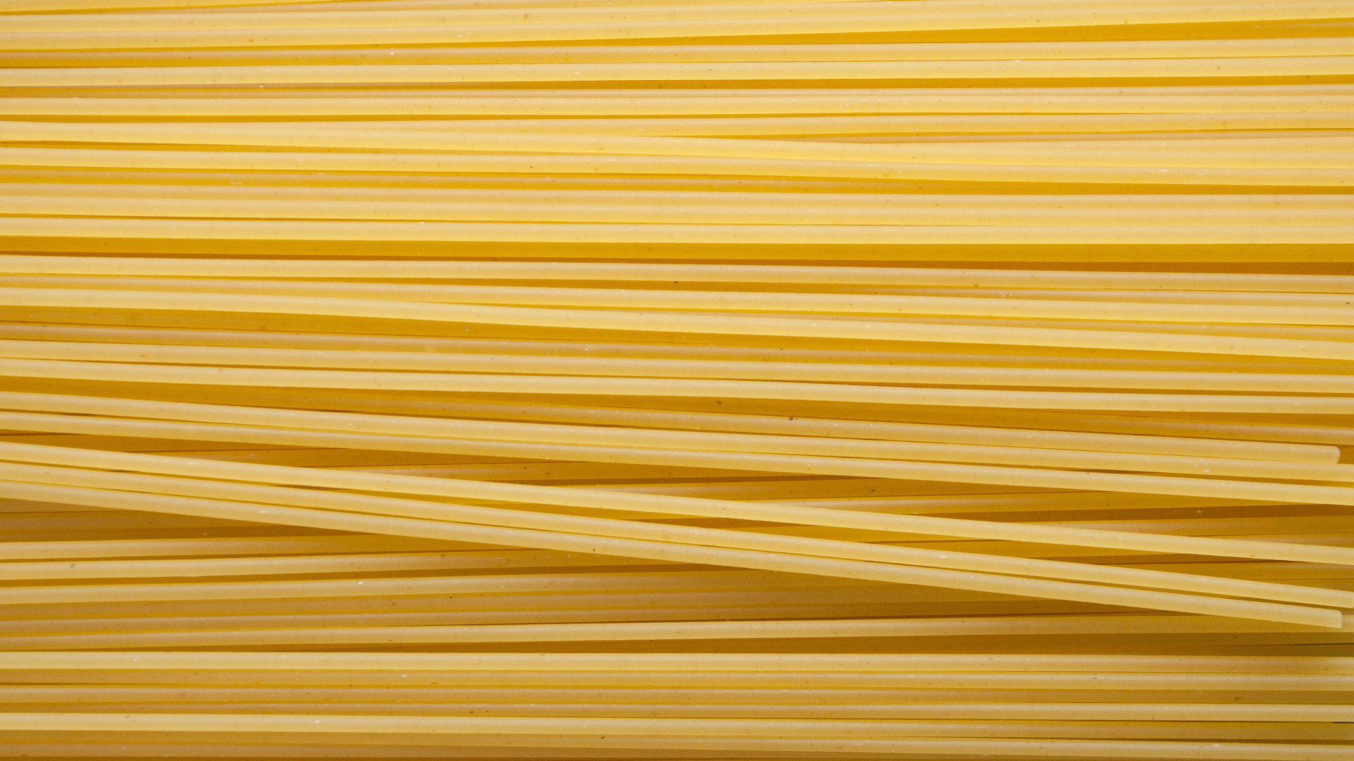 Strands of uncooked spaghetti