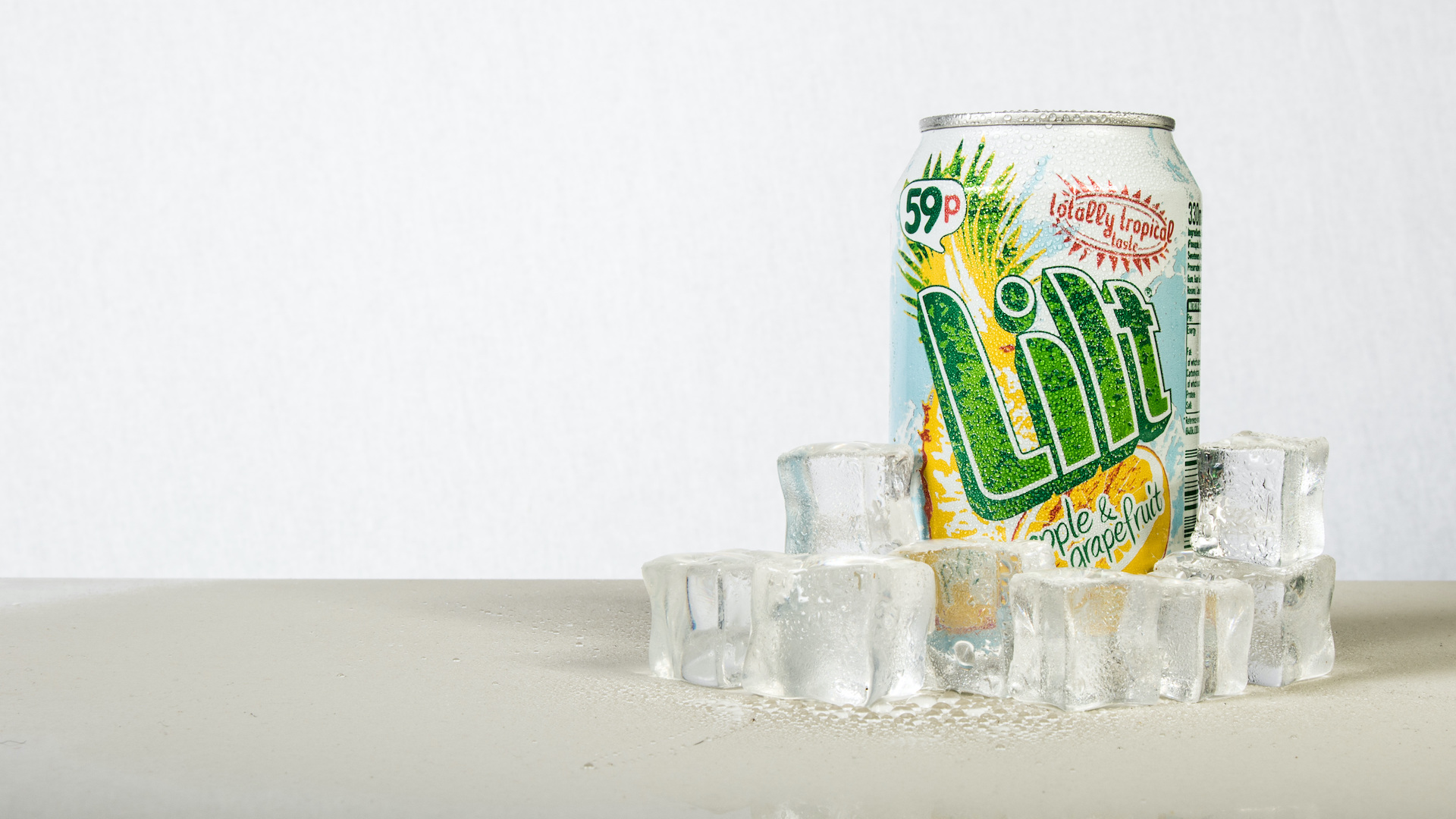 A can of Lilt, surrounded by ice cubes