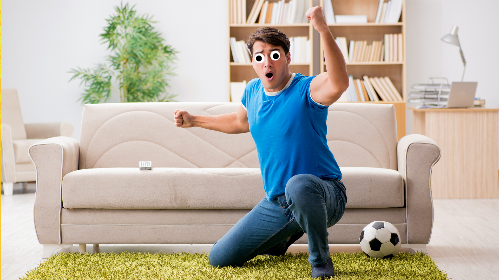 A football fan watching the match at home