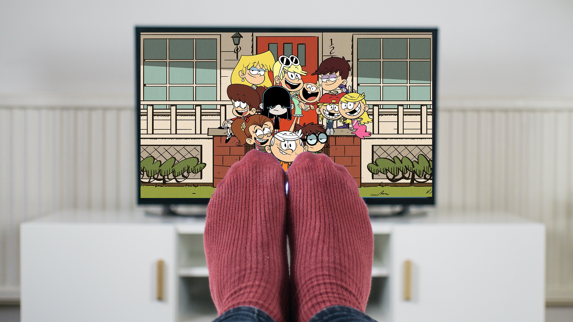 Person with feet up watching The Loud House
