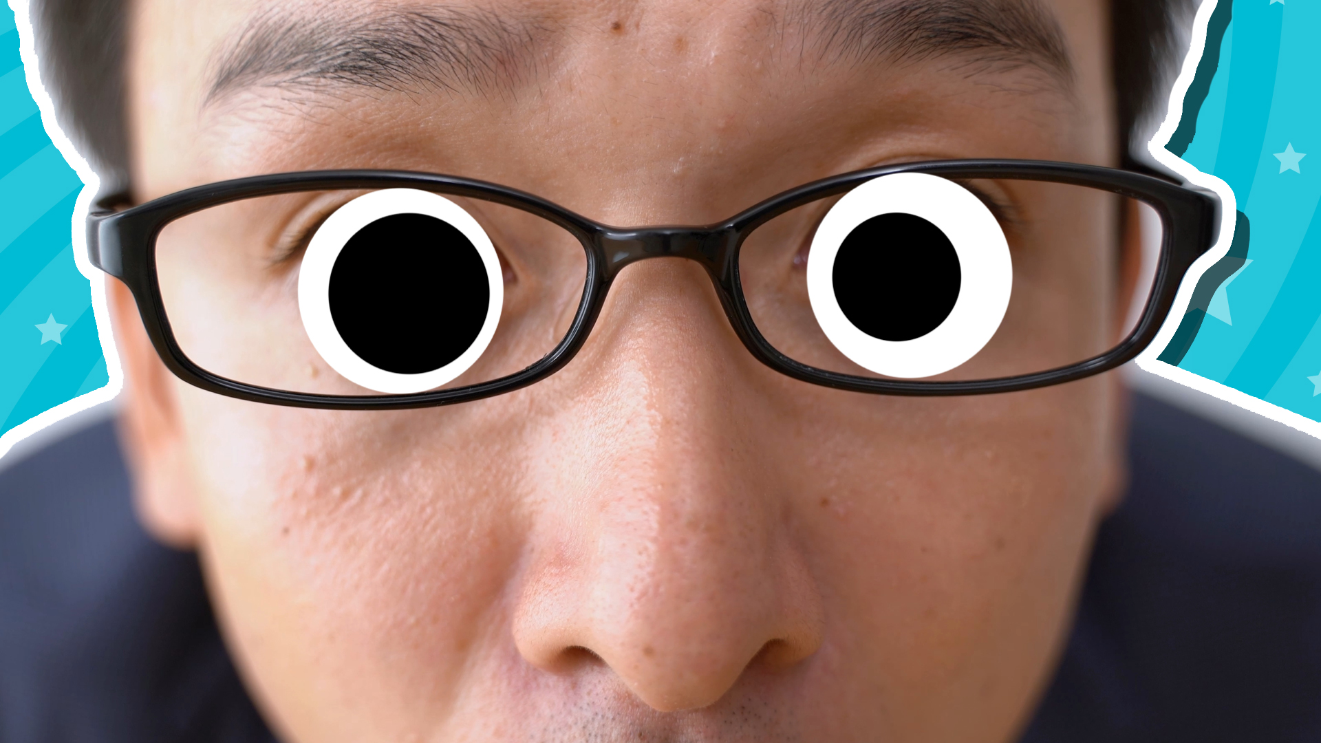 A man staring through his reading glasses